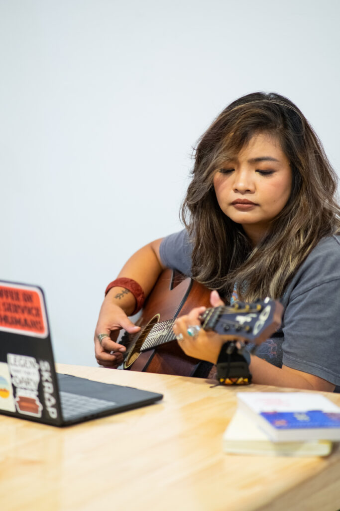 Fiona Quinn holding a guitar